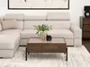 A living room scene featuring a sectional sofa and a coffee table. Náhled obrázku produktu