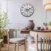 A dining room scene with a clock on the wall and chairs around a table. Anteprima dell’immagine prodotto