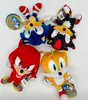 A collection of Sonic the Hedgehog plush toys arranged on a white background. Produktbild-Vorschau