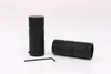 Two black cylinder-shaped curtain rod finials and an Allen key on a white background. Produktbild-Vorschau