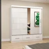 A white sliding door wardrobe with a mirror on the right side, placed in a room with light-colored walls and wooden flooring. Voir les images du produit