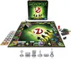 A Ghostbusters-themed Monopoly board game set is displayed on a white background, with the game box, board, money, and playing pieces visible. Produktbild-Vorschau