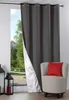 A curtain is partially drawn, revealing a view of a park and a chair with a pillow. Podgląd zdjęcia produktu