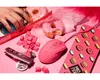 A pink gaming mouse, donuts, and other items are arranged on a pink surface. Produktbild-Vorschau
