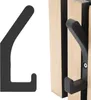 A black hook is shown on a white background, and another black hook is attached to a wooden acoustic panel. Produktbild-Vorschau