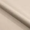 A roll of beige fabric. Voir les images du produit