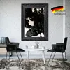 A modern living room scene with a framed picture on the wall, two chairs, and a coffee table. Produktbild-Vorschau