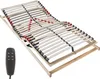 A wooden bed frame with adjustable slats and a remote control. Produktbild-Vorschau