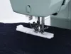 A close-up view of a sewing machine's presser foot and buttonhole attachment on dark fabric. Anteprima dell’immagine prodotto