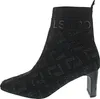 A black knitted ankle boot with a patterned design and a block heel, shown from the side against a white background. Produktbild-Vorschau