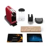 A Nespresso coffee machine and its accessories are laid out on a white background. Anteprima dell’immagine prodotto