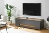 A modern living room with a TV stand, TV, plant, and sofa. Produktbild-Vorschau