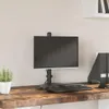 A monitor stand is shown on a wooden desk. Náhľad obrázku produktu