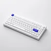 A white mechanical keyboard with blue accent keys is shown on a white background. Voir les images du produit