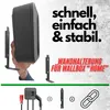 A hand holding a black wallbox charger with mounting brackets and text overlays. Produktbild-Vorschau