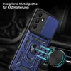 A close-up shot of a blue phone case with a magnetic car mount attachment, set against a dark, blurred background suggesting a car interior. Produktbild-Vorschau
