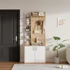 A hallway storage unit with shelves and cabinets, placed next to a door. Produktbild-Vorschau