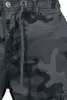 Close-up of the waistband and upper leg of camouflage pants. Produktbild-Vorschau