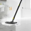 A steam mop is being used to clean a tiled floor in a bathroom. Produktbild-Vorschau