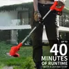 A person is holding a red electric grass trimmer in a yard with a modern house in the background. Produktbild-Vorschau