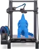 A 3D printer is printing a blue Godzilla-like figure. Náhled obrázku produktu