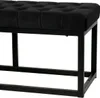 A close-up, low-angle shot of a black tufted bench. Náhled obrázku produktu