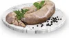 A raw sausage is presented on a marble plate with peppercorns and herbs. Náhled obrázku produktu
