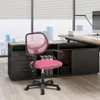 A pink office chair is placed in front of a desk and a window with a city view. Produktbild-Vorschau