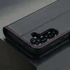 A close-up view of a black leather phone case with red stitching, showing the camera cutout. Anteprima dell’immagine prodotto