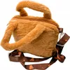A plush capybara-shaped handbag with a strap. Produktbild-Vorschau