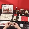 A 3D mechanical steam engine model kit, with its packaging and components laid out on a dark surface. Produktbild-Vorschau
