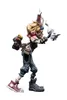 A stylized action figure of a character with blonde hair, wearing a brown top, gray pants, and mismatched shoes. The figure is holding two items in its hands and has bunny ears on its head. Anteprima dell’immagine prodotto