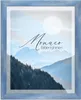 A framed picture of mountains with text overlay. Produktbild-Vorschau