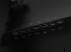 A close-up view of the ports on the back of a black monitor. Produktbild-Vorschau