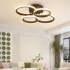 A modern living room with a ceiling lamp, sofa, and plants. Náhľad obrázku produktu