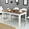 A dining table set in a modern dining room with chairs, tableware, and decorative items. Anteprima dell’immagine prodotto