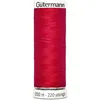 A spool of red thread on a white background. Produktbild-Vorschau