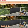 A balcony with a privacy screen installed along the railing, with chairs and a table set up. Podgląd zdjęcia produktu