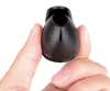 A hand holding a black chair leg cap. Anteprima dell’immagine prodotto
