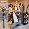 People are enjoying karaoke at home with a speaker and microphones. Produktbild-Vorschau