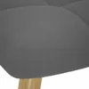 A close-up view of the textured fabric of a dark gray armchair and a wooden leg. Náhľad obrázku produktu