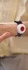 A person's arm wearing a medical alert bracelet. Produktbild-Vorschau