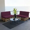 Outdoor balcony with a view of the ocean, featuring pallet furniture and coffee tables. Produktbild-Vorschau