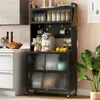 A modern kitchen scene featuring a black metal kitchen storage rack filled with various items like jars, mugs, a coffee maker, and plants. Produktbild-Vorschau
