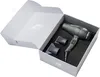 A hairdryer and its accessories are neatly arranged in an open box. Náhled obrázku produktu