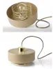 Two views of a modern beige and gold pendant lamp with a wire cage around the bulb. Produktbild-Vorschau
