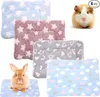 A collage of pet bedding mats with different patterns and two small animals (a guinea pig and a rabbit). Produktbild-Vorschau