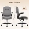 A diagram showing the dimensions of a gray office chair. Voir les images du produit