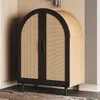 A cabinet with arched doors and cane detailing, set against a neutral wall. Produktbild-Vorschau