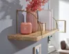 A wooden shelf mounted on a gray wall, decorated with a vase, a lantern, and books. Podgląd zdjęcia produktu